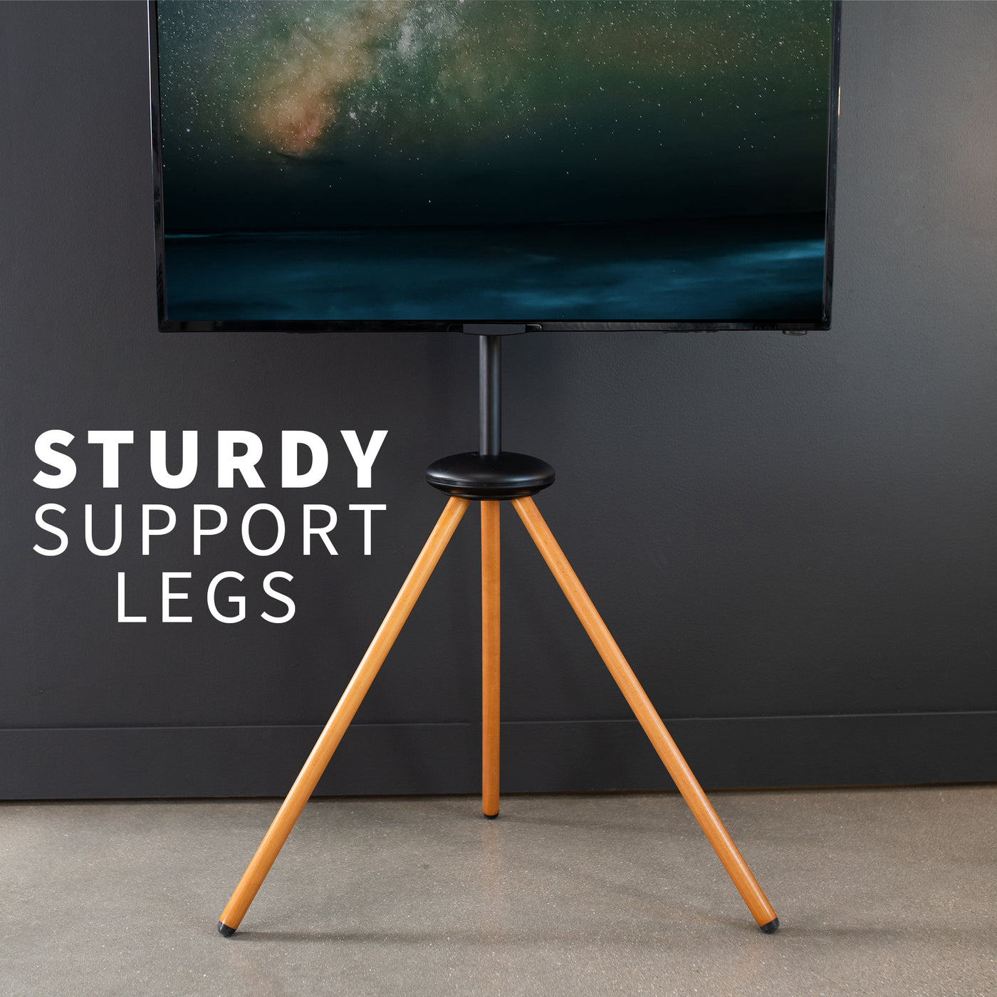 Dark walnut foldable easel studio TV stand supports 43” to 65” TV screens weighing up to 66 lbs. This collapsible tripod accommodates on-the-go presentations while also providing solid support for your screen.