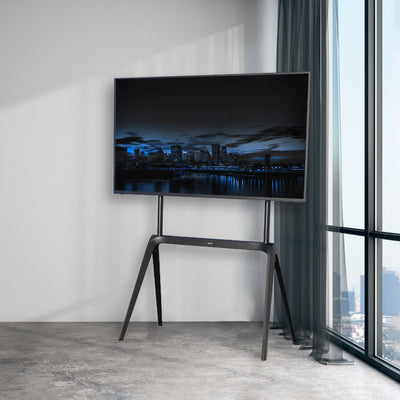 Sturdy easel TV set up in the corner of a modern space.