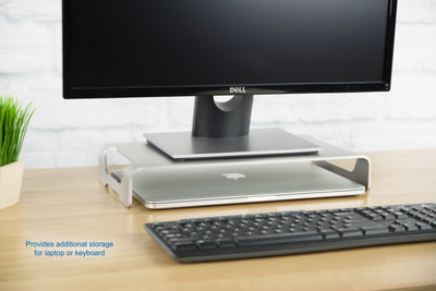 Elevated laptop with keyboard and mouse stored unearth monitor laptop riser.