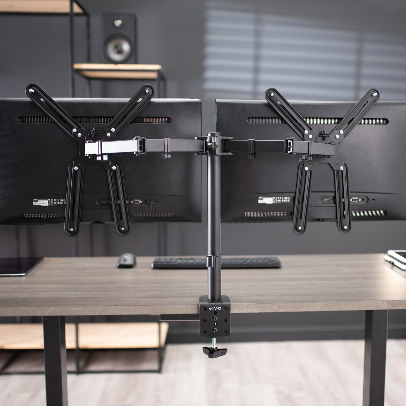 Dual monitor desk mount with VESA Adapter bracket designed for monitors lacking VESA compatibility.