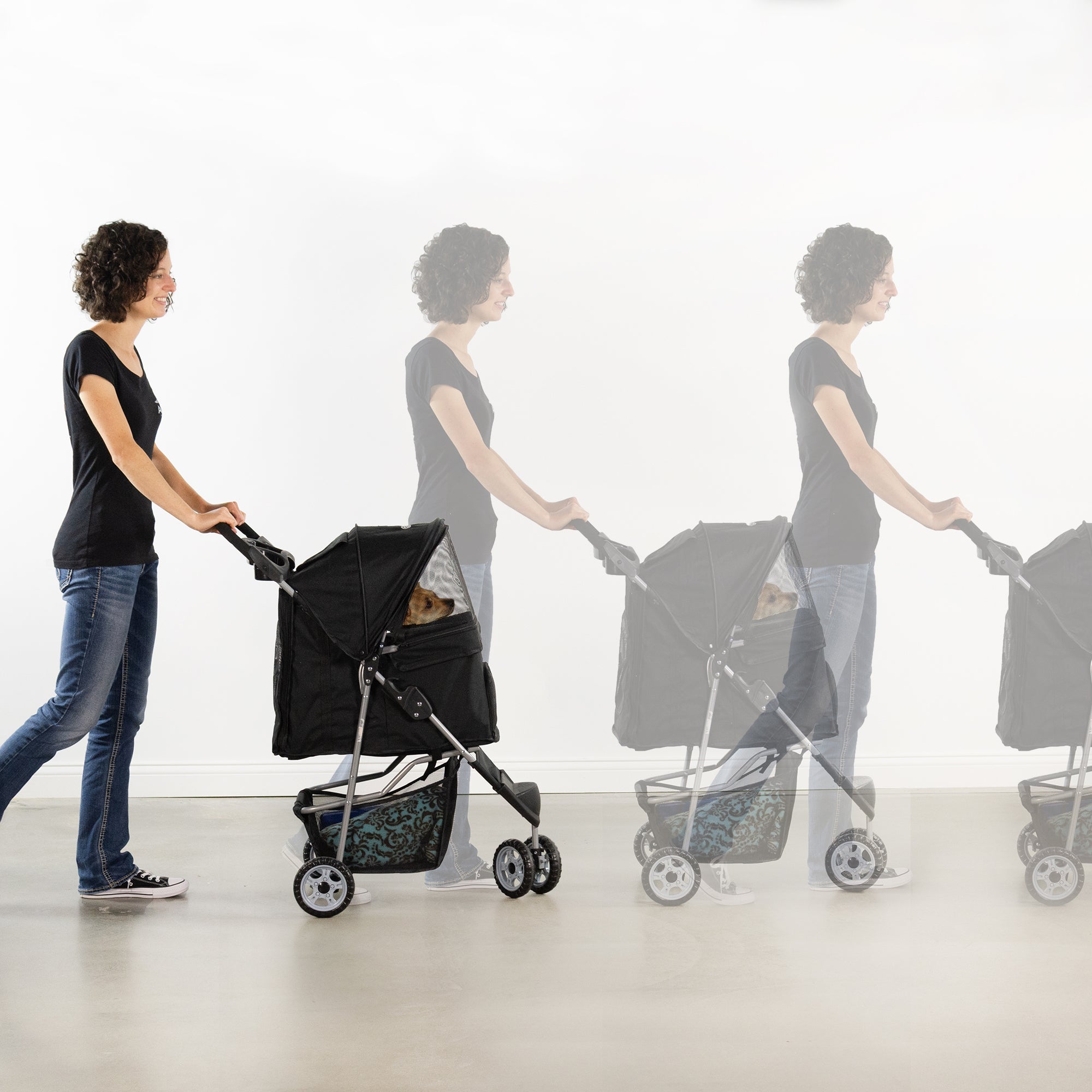 girl pushing dog in Black Three Wheel Pet Stroller