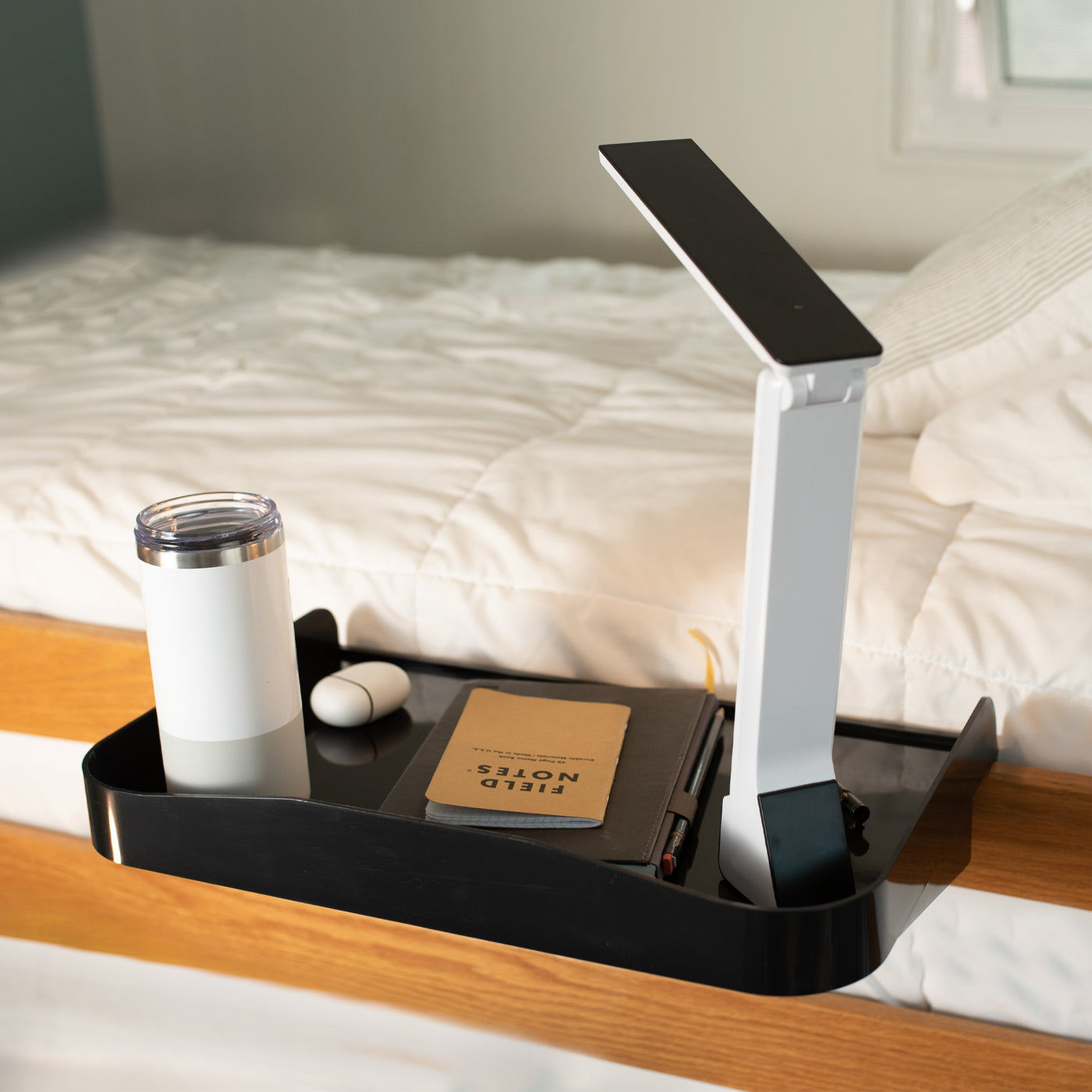 Attachable bedside shelf nightstand tray for storage and organizing.